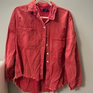 Vici distressed red denim jacket.